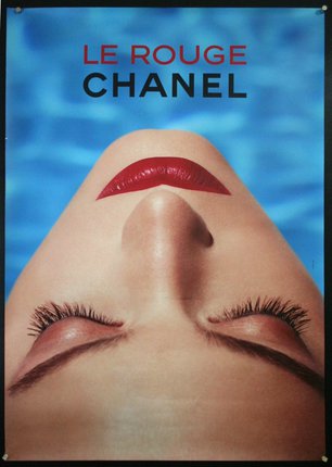 a woman with red lipstick and eyes closed