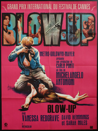 poster with scene from the film with a photographer straddling a woman