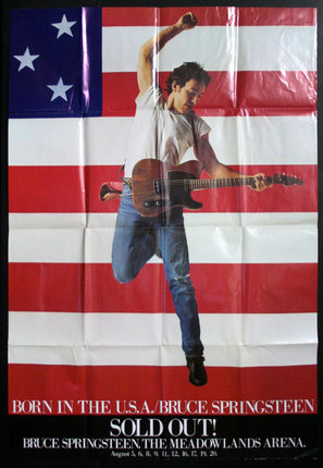 a poster of a man playing guitar