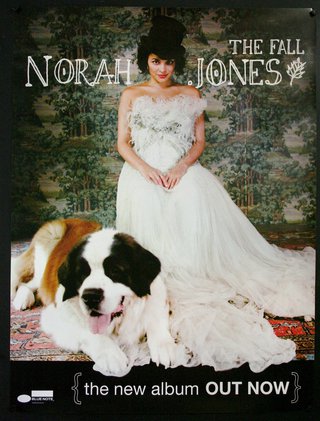 a woman in a white dress and a dog