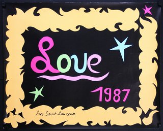 a black and yellow frame with a yellow border with pink and blue text