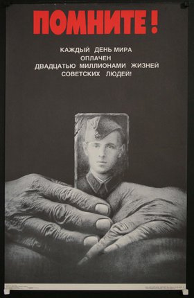 a poster with hands holding a picture of a man