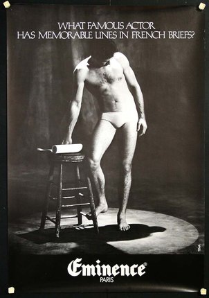 a man standing next to a stool