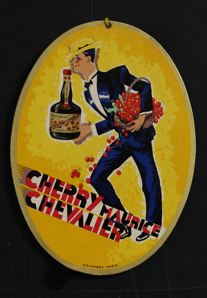 a yellow oval sign with a man holding a bottle of liquor
