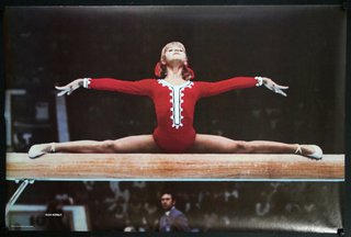 a woman doing a split on a beam