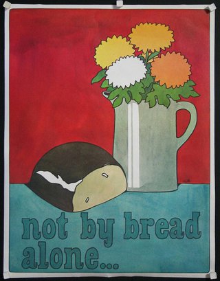 a poster of a loaf of bread beside a mug of flowers