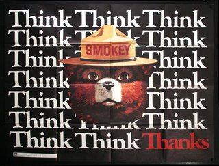 a poster with a bear wearing a fire hat
