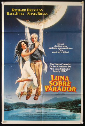 a movie poster with a man and woman holding a moon