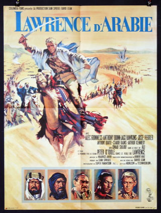 a movie poster with a man riding a camel