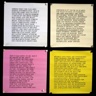 a group of colorful papers with black text