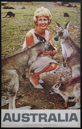 a woman holding two kangaroos