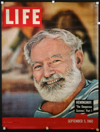 a man with a beard on a cover of a magazine