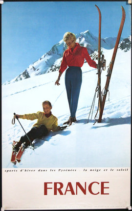 a woman and boy on skis in the snow