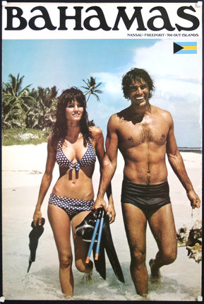 a man and woman in swimsuits on a beach