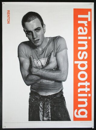 a man with wet hair and wet shirt crossing his arms