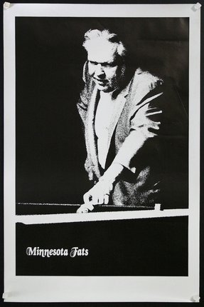 a man playing pool with a black background