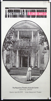 a woman in a long dress standing in front of a building