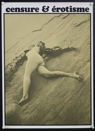 a woman lying on sand