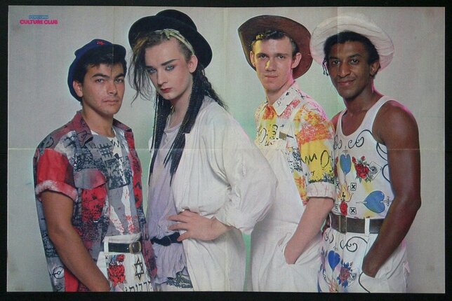 a group of men posing for a photo