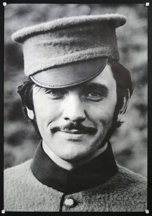 a man with a mustache wearing a hat