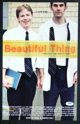 a couple of young men wearing ties and holding books