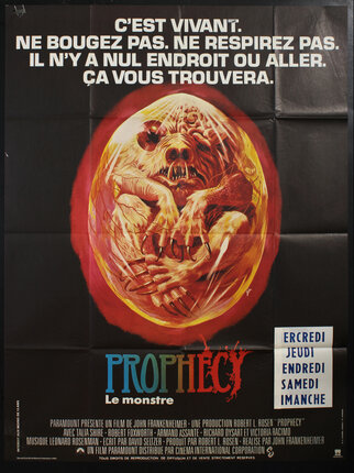 a movie poster with a monster in an egg