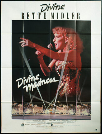 a poster of Bette Midler singing on stage