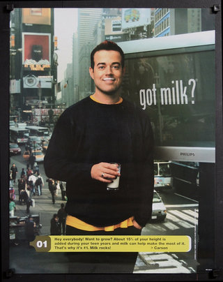 a man holding a glass of milk