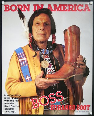a man holding a boot
