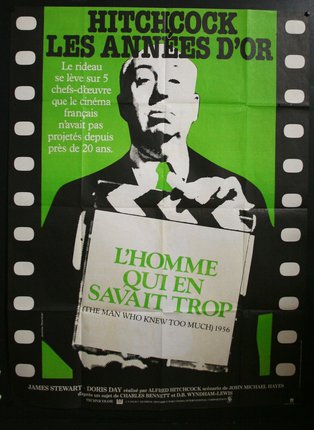 a movie poster with a man holding a clapper board