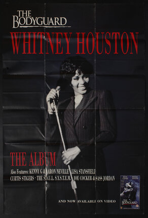 poster with text and singer/actress Whitney Houston holding a microphone