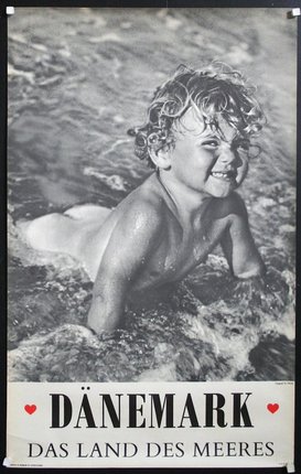 a black and white photo of a child in water