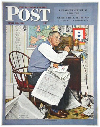 a man sitting at a desk with a cat and newspaper
