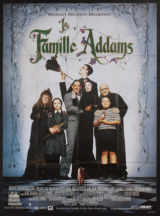 a movie poster with an Addams family portrait