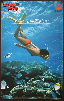 a woman swimming underwater with a snorkel