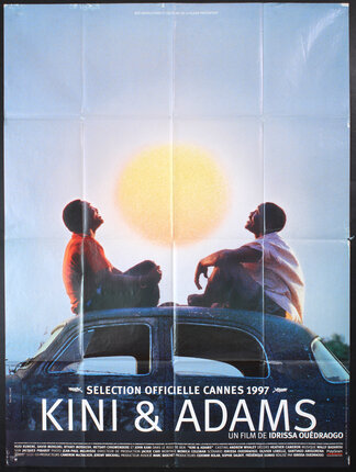a movie poster of two men sitting on top of a car