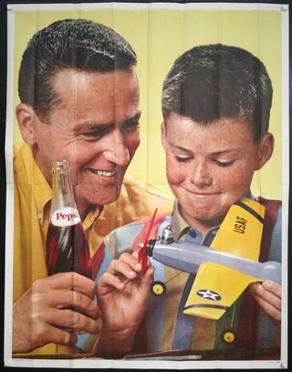 a man and boy holding a toy airplane