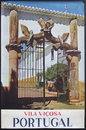 a gate with a statue on it