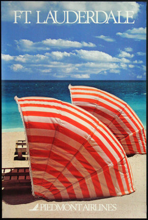 a red and white striped umbrellas on a beach