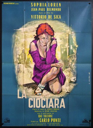 a poster of a woman sitting on the ground