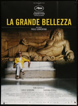 a movie poster of a man sitting on a stone bench