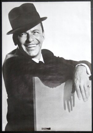 a man leaning on a chair