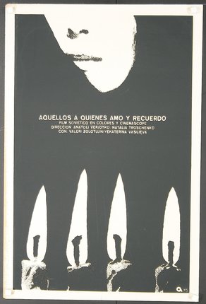 a poster with a face and several candles