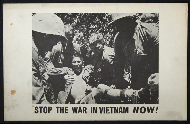 a group of soldiers holding a man