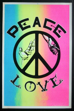 a colorful sign with a peace sign and text