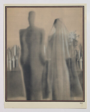 a blurry image of a bride and groom