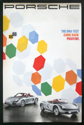 a poster of a car and a car