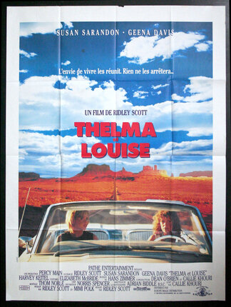 a movie poster of two women in a convertible