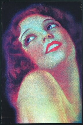 a woman with red hair and red lipstick