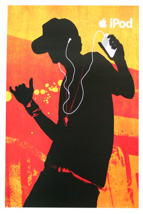 a man holding a phone and listening to music